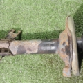 Амортизатор передній лівий голий без пружини Nissan X-Trail T30 (2001-2007) 543038H726