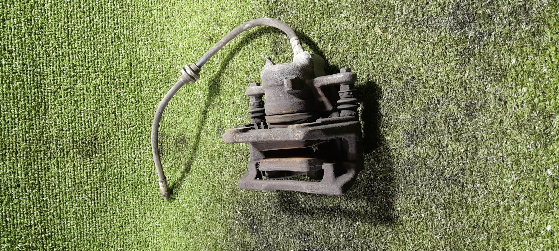 Суппорт передній лівий Renault Kangoo I (1997-2009) 7701208332